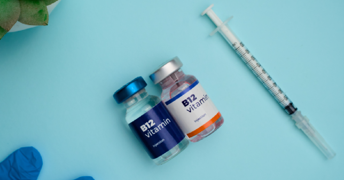 B12 vitamin injection vials and syringe ready for medical treatment in Evans, GA, Sumner Aesthetics